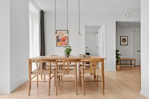 a dining room with a table and chairs at Spacious 2BR Inner City Apartment for 6 People in Aarhus +31 photos