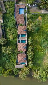 an overhead view of a house with a pool at Anama by Queens Mount in Tangalle