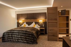 Ein Bett oder Betten in einem Zimmer der Unterkunft Hotel Garni Pra Posta