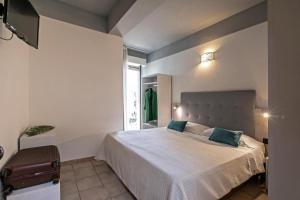 Postel nebo postele na pokoji v ubytování Hotel Noah