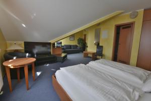 Postel nebo postele na pokoji v ubytování Hotel Nord