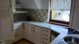 a kitchen with a sink and a window at Otto in Reding