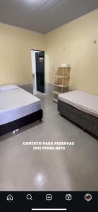 Giường trong phòng chung tại Rancho 3 Irmãs Rio Araguaia Pará