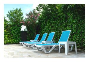 a row of blue and white lounge chairs on a patio at Istrian Azure in Pula