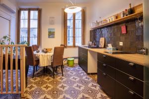 a kitchen with a table and a dining room at Workshop in Béziers