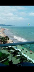 a view of a beach with people in the water at Departamento mirador al mar in Tonsupa +10 photos