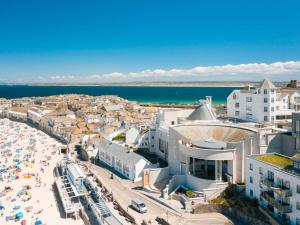 an aerial view of a city with a beach at Henrys in St Ives
