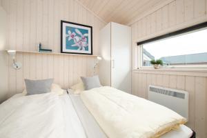 Postel nebo postele na pokoji v ubytování Resort 2 Ferienhaus Typ D 28