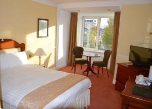 Rúm í herbergi á Brandon Hotel Conference & Leisure Centre