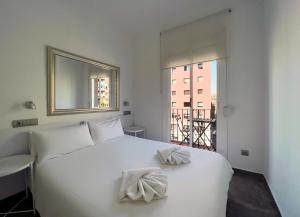 Posteľ alebo postele v izbe v ubytovaní Stay U-nique Apartment Rambla Badal