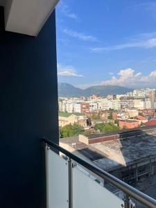 a balcony with a view of a city at Pegasus luxury 1 in Tirana