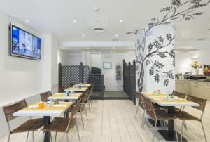 TV a/nebo společenská místnost v ubytování c-hotels Atlantic