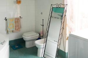 A bathroom at Camera privata con cucina