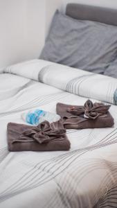 Postel nebo postele na pokoji v ubytování CJ Apartments