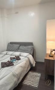 Postel nebo postele na pokoji v ubytování CJ Apartments