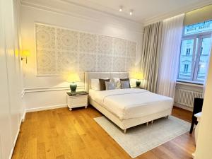 Łóżko lub łóżka w pokoju w obiekcie MONDRIAN Luxury Suites & Apartments Old Town