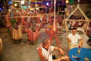 a group of people sitting in chairs on a carousel at Irini Stalis by Estia in Stalida +19 photos