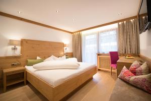 Giường trong phòng chung tại Hotel Garni Glockenstuhl