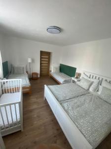 a living room with two beds and a couch at Na Gruntě in Škvořetice