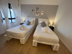 Ένα ή περισσότερα κρεβάτια σε δωμάτιο στο Flat in Armacao de Pera