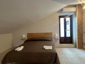 Postel nebo postele na pokoji v ubytování Palazzo 1815
