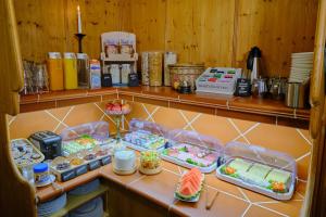 a kitchen with some food on a shelf at Anno 1900 Hotel Babelsberg in Potsdam