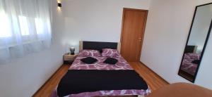 Posteľ alebo postele v izbe v ubytovaní Apartments Seven Castles