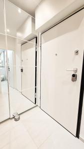 a bathroom with a shower and a glass door at Apartment ReLakes in Plitvička Jezera +17 photos