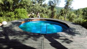 a swimming pool in the middle of a building at A Choupana Alentejo Rústico in Troviscais