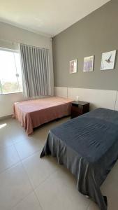 Ένα ή περισσότερα κρεβάτια σε δωμάτιο στο Casa Lago de Furnas