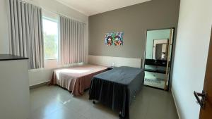 Ένα ή περισσότερα κρεβάτια σε δωμάτιο στο Casa Lago de Furnas +25 φωτογραφίες