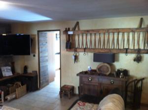 a living room with a staircase and a couch at Au Chant Des Marmites in Saint-Lary-Soulan