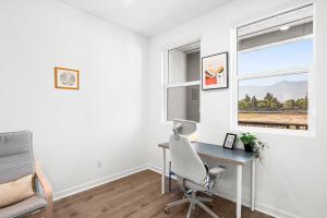 an office with a desk and a chair and a window at Luxurious Ontario Townhouse Ideal Family in Ontario