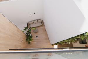 a view of the lobby of a building with plants at Azure Homes in Conil de la Frontera