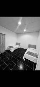 Voodi või voodid majutusasutuse Tagalradia Hostel toas