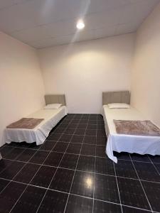 Voodi või voodid majutusasutuse Tagalradia Hostel toas