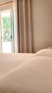 Postel nebo postele na pokoji v ubytování Hotel Ceka