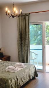 Postel nebo postele na pokoji v ubytování Hotel Ceka