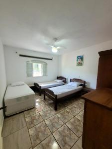 Postel nebo postele na pokoji v ubytování Chácara Recanto dos Sonhos + 8 fotografií