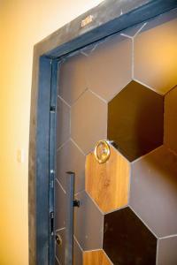 a door with a ring on top of it at Blessed homes in Nairobi +11 photos