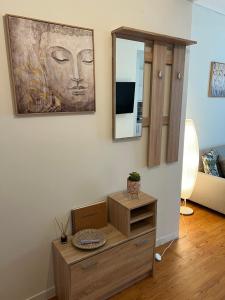 a room with a painting of a face on the wall at Acropolis Sidewalk view in Athens