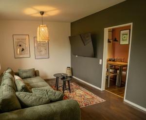 a living room with a couch and a table at Ferienhaus 'Emma' Rodalben in Rodalben