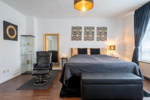 Ένα ή περισσότερα κρεβάτια σε δωμάτιο στο City Suite Hannover