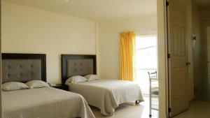 Postel nebo postele na pokoji v ubytování Hotel Insurgentes Express