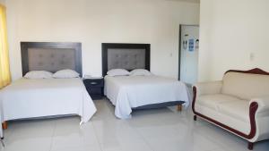 Postel nebo postele na pokoji v ubytování Hotel Insurgentes Express