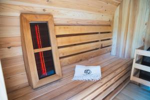 an inside view of a wooden cabin with a window at Bed en Wellness Groenrust Putten in Putten
