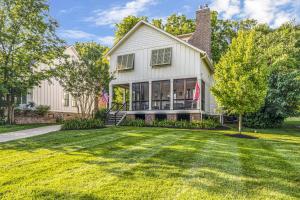a white house with a lawn in front of it at Musician's Ranch in Franklin