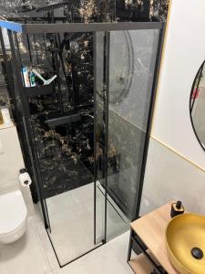 a bathroom with a shower with a view of the city at M&M tisno in Tisno +33 photos