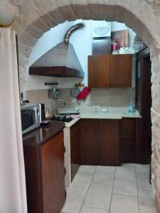 A kitchen or kitchenette at Trullo Monte Del Sale