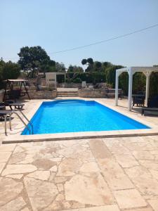 The swimming pool at or close to Trullo Monte Del Sale